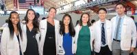 Anne Armstrong-Coben, third from left, posed at the 2019 White Coat Ceremony with some of the Class of 2023 members she helped choose while interim senior associate dean for admissions. Photo by Amelia Panico.
